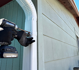 Attaching a gutter to a house